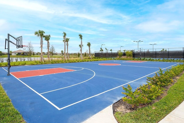 view of basketball court featuring community basketball court and fence