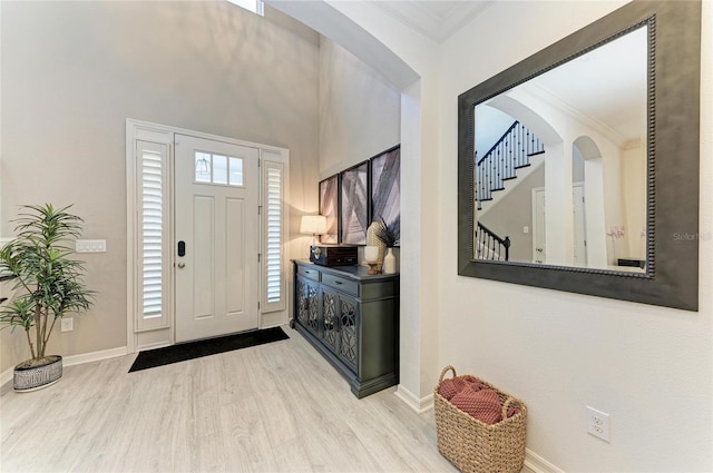 5709 Sunflower Cir, Sarasota, FL 34238 - foyer featuring baseboards, wood finished floors, and crown molding