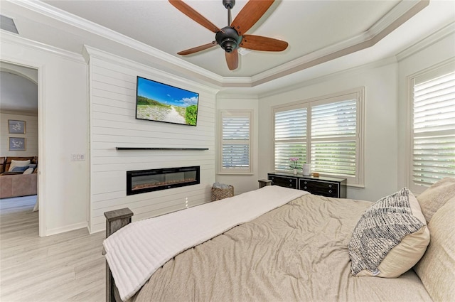 5709 Sunflower Cir, Sarasota, FL 34238 - bedroom with arched walkways, multiple windows, and crown molding