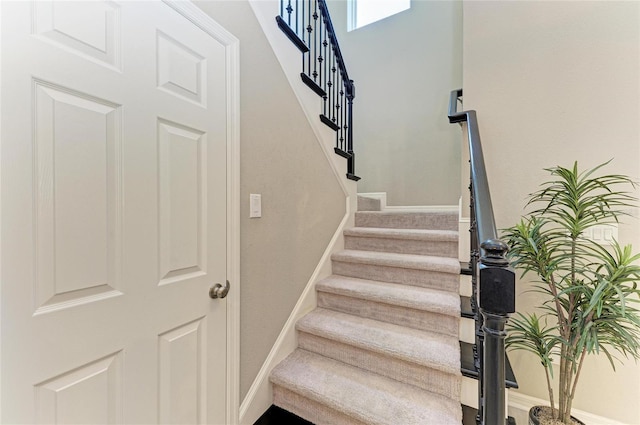 5709 Sunflower Cir, Sarasota, FL 34238 - stairs featuring carpet floors and baseboards