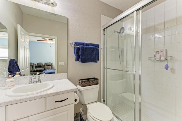 5709 Sunflower Cir, Sarasota, FL 34238 - ensuite bathroom featuring visible vents, toilet, a stall shower, connected bathroom, and vanity