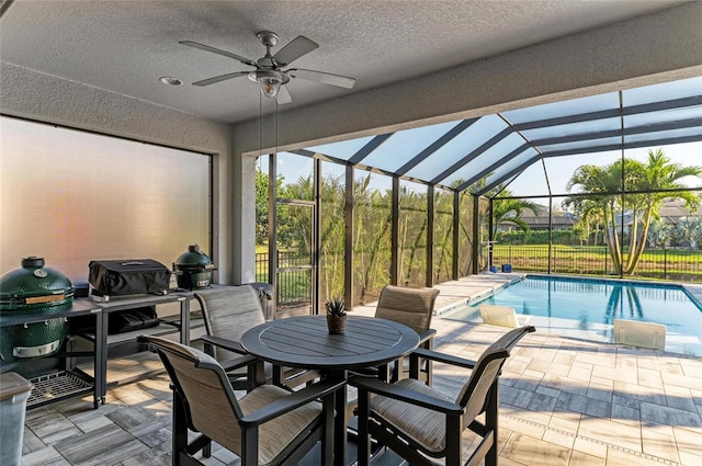5709 Sunflower Cir, Sarasota, FL 34238 - view of patio with a lanai, a fenced in pool, outdoor dining area, and a ceiling fan