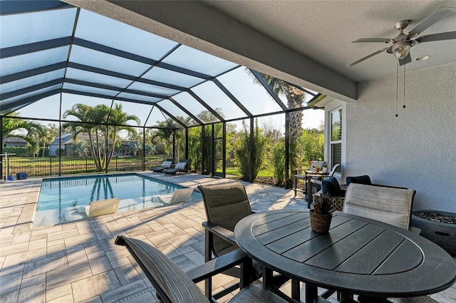 5709 Sunflower Cir, Sarasota, FL 34238 - pool with ceiling fan, a patio, outdoor dining space, and a lanai