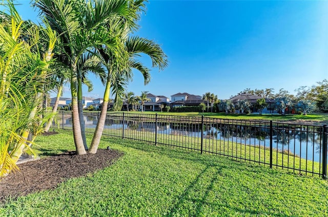 5709 Sunflower Cir, Sarasota, FL 34238 - view of yard with a water view, a residential view, and fence