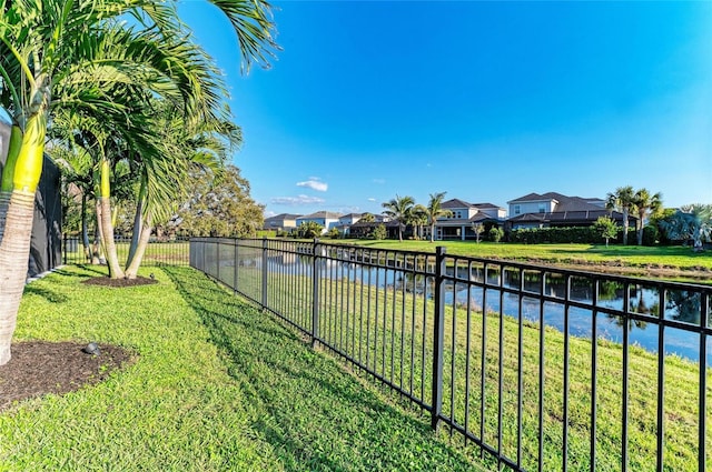 5709 Sunflower Cir, Sarasota, FL 34238 - view of yard with a residential view, a water view, and fence