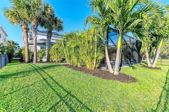 5709 Sunflower Cir, Sarasota, FL 34238 - view of yard featuring a lanai and a fenced backyard
