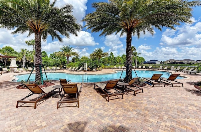 5709 Sunflower Cir, Sarasota, FL 34238 - community pool with a patio area and fence