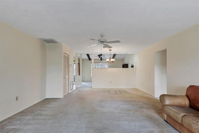 unfurnished living room featuring ceiling fan with notable chandelier, visible vents, and light colored carpet