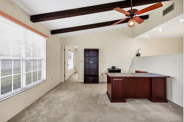 home office with a ceiling fan, visible vents, lofted ceiling with beams, and light carpet