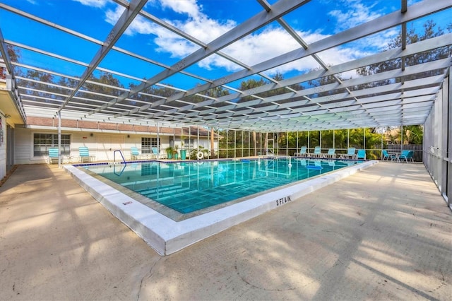 community pool with a lanai and a patio