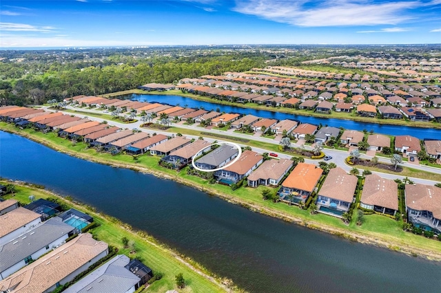 bird's eye view featuring a residential view and a water view