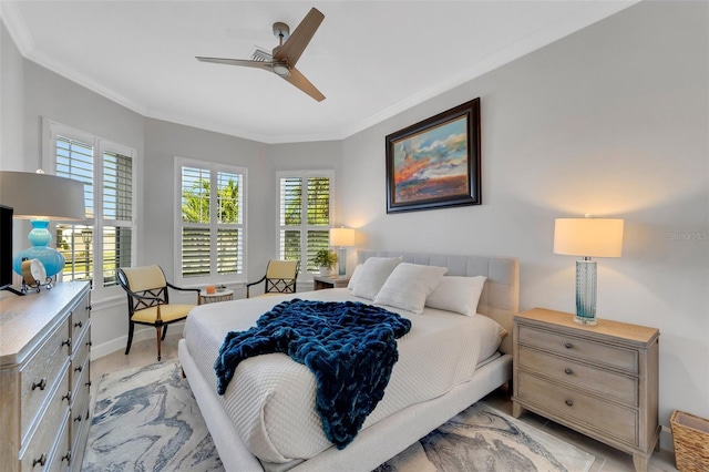 bedroom with ceiling fan, ornamental molding, and baseboards