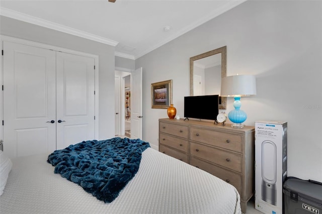 bedroom featuring ornamental molding and a closet