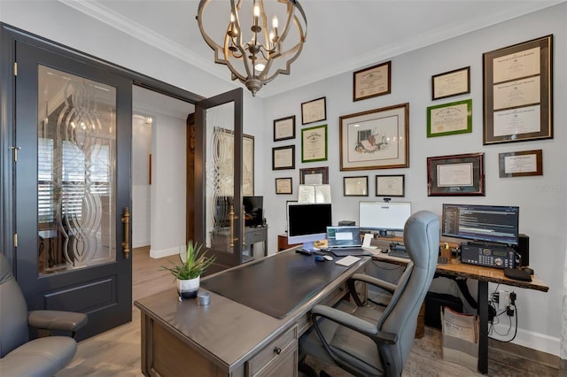 office space with ornamental molding, an inviting chandelier, wood finished floors, and baseboards