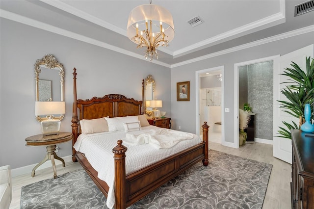 bedroom with crown molding, a raised ceiling, visible vents, and a notable chandelier