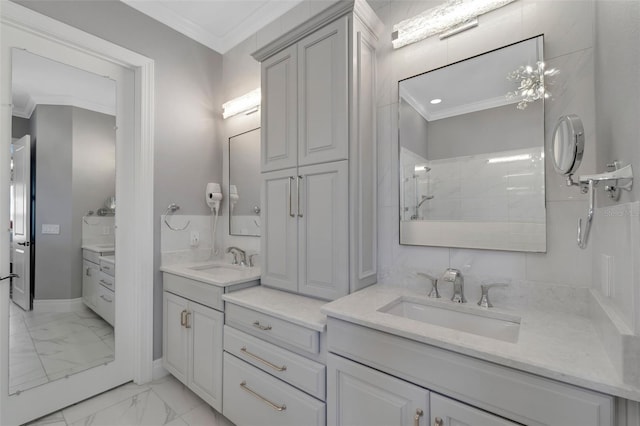 bathroom featuring crown molding, marble finish floor, a sink, and double vanity