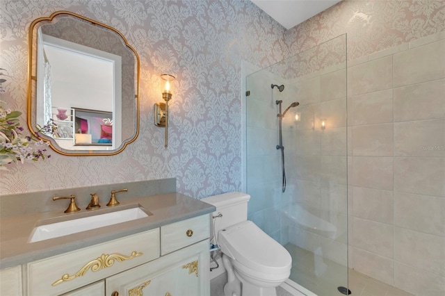 bathroom featuring walk in shower, vanity, toilet, and wallpapered walls