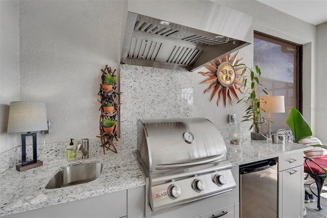 kitchen with white cabinets, refrigerator, light stone countertops, a sink, and exhaust hood