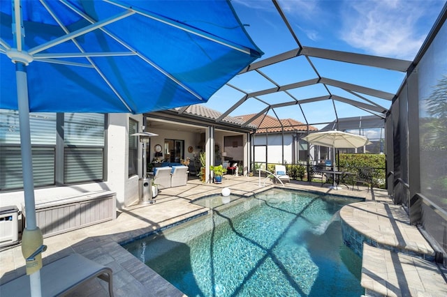 outdoor pool featuring a lanai and a patio area