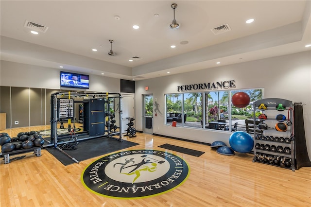 workout area featuring visible vents, wood finished floors, and recessed lighting