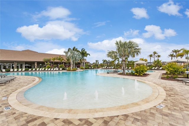 community pool featuring a patio area