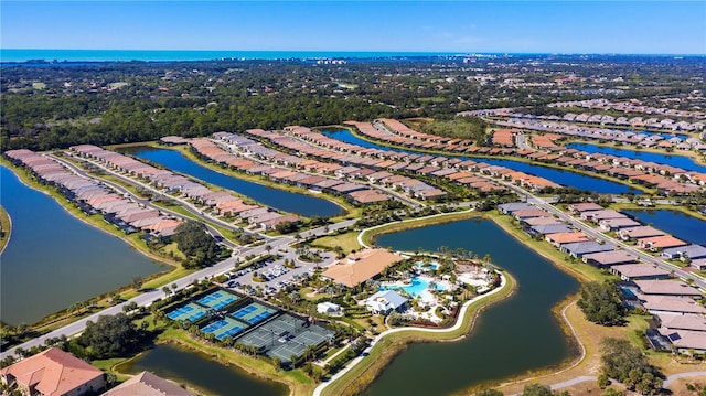 birds eye view of property featuring a residential view and a water view