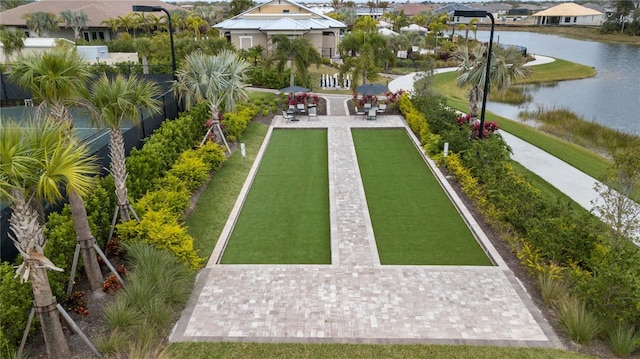 birds eye view of property with a water view and a residential view