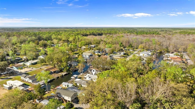 birds eye view of property with a residential view and a view of trees