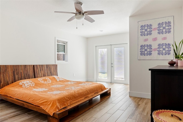 bedroom featuring light wood finished floors, baseboards, ceiling fan, access to exterior, and french doors