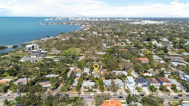 bird's eye view featuring a water view and a residential view