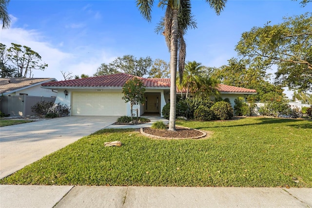 mediterranean / spanish-style house featuring an attached garage, concrete driveway, a tiled roof, stucco siding, and a front lawn