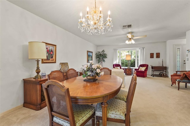 dining space with a ceiling fan, light colored carpet, visible vents, and baseboards