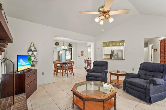 living room with vaulted ceiling, ceiling fan, and light tile patterned flooring