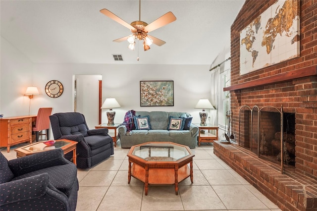 living area featuring light tile patterned flooring, a fireplace, visible vents, and a ceiling fan