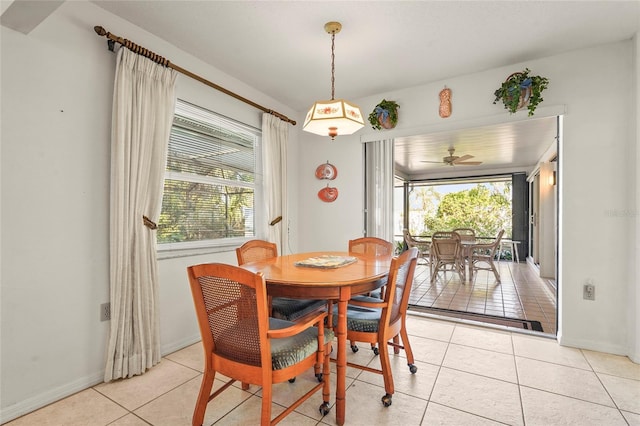 dining area with light tile patterned floors and baseboards