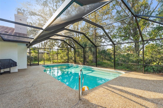 pool with a patio and a lanai