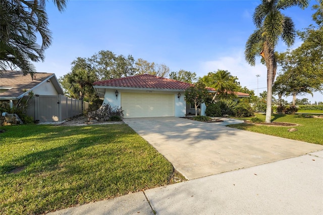 view of front of home with a tile roof, stucco siding, a front yard, a garage, and driveway