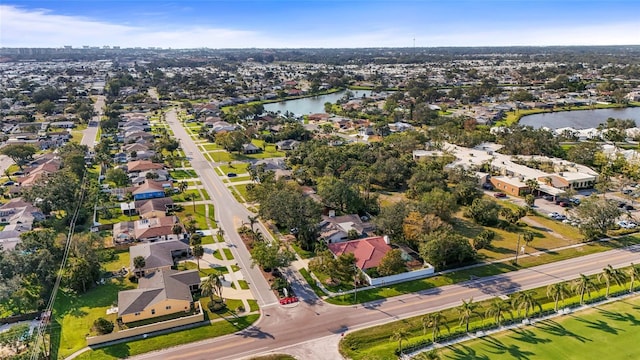 birds eye view of property featuring a water view and a residential view