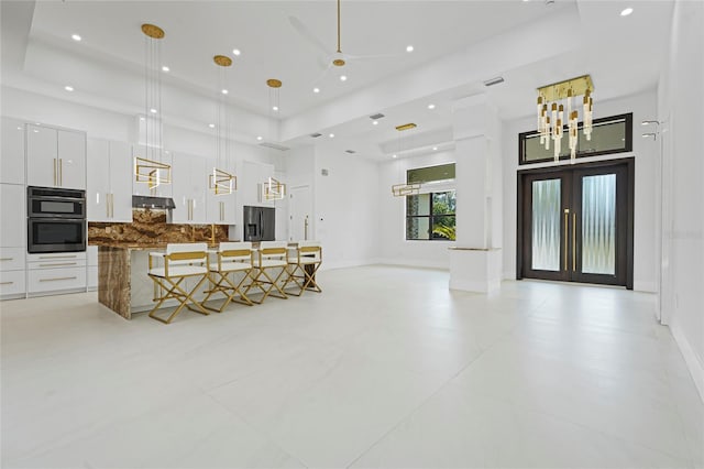 living room featuring french doors, recessed lighting, visible vents, and baseboards