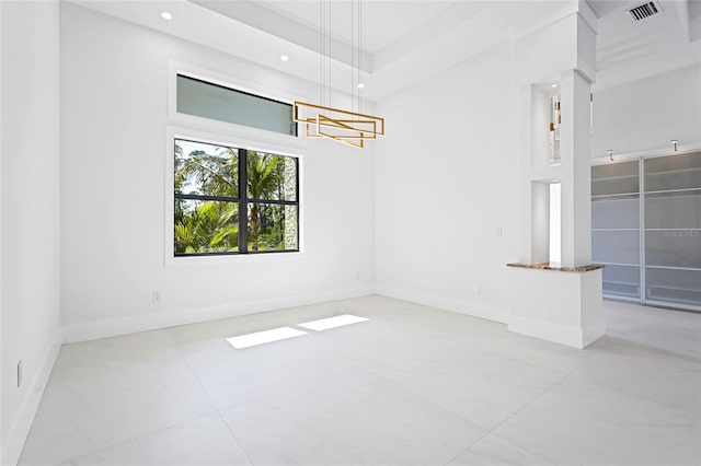 unfurnished room featuring recessed lighting, visible vents, and baseboards