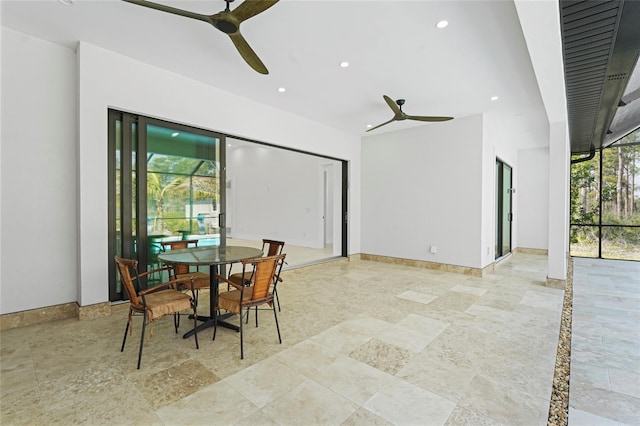 dining room featuring baseboards, a ceiling fan, and recessed lighting