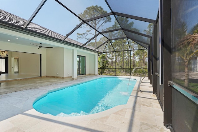 outdoor pool with ceiling fan, a patio, and a lanai