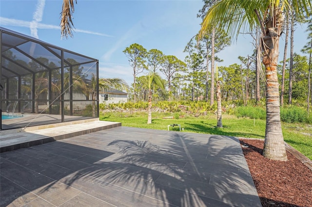 view of patio / terrace with a lanai and an outdoor pool