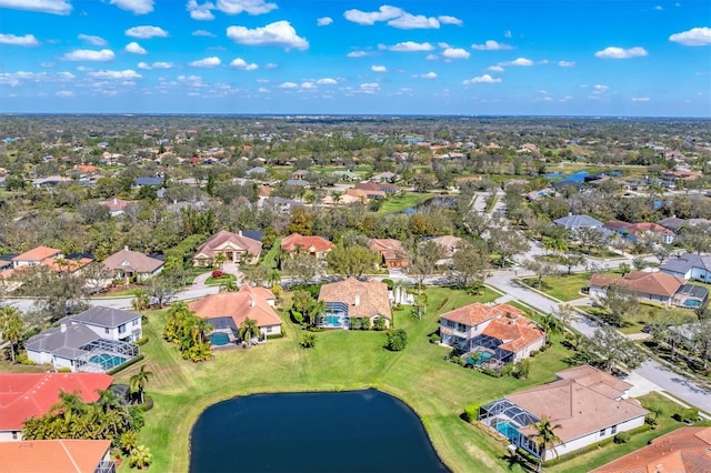 aerial view with a residential view and a water view