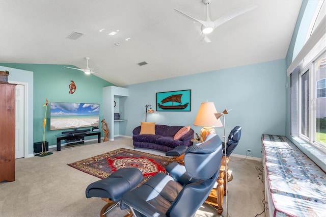 living area with lofted ceiling, ceiling fan, carpet flooring, and visible vents