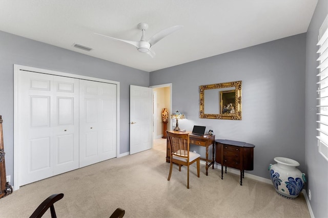 office area featuring carpet, visible vents, ceiling fan, and baseboards