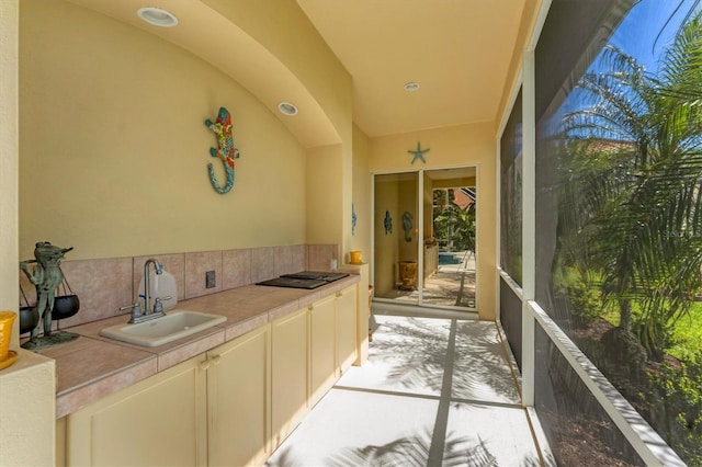 view of patio with an outdoor kitchen and a sink