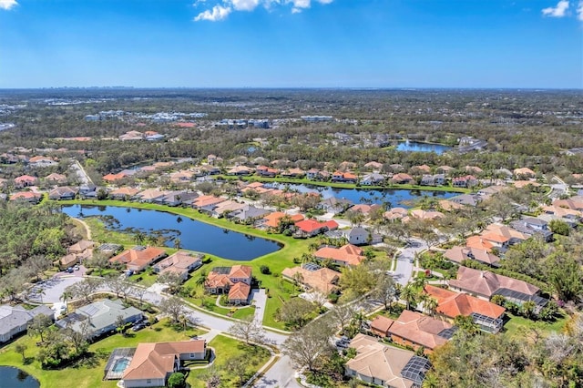 birds eye view of property featuring a residential view and a water view