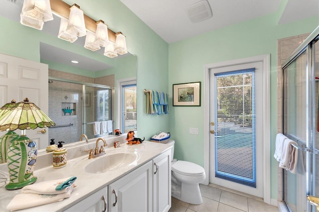 9612 Old Hyde Park Pl, Bradenton, FL 34202 - full bath with tile patterned floors, plenty of natural light, vanity, and toilet