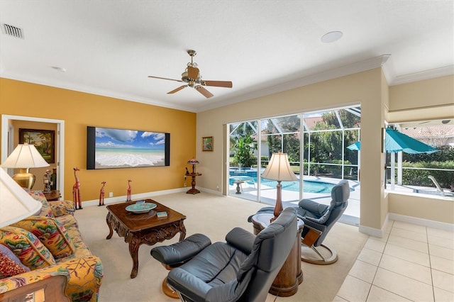 9612 Old Hyde Park Pl, Bradenton, FL 34202 - living room featuring a ceiling fan, a sunroom, ornamental molding, baseboards, and light colored carpet